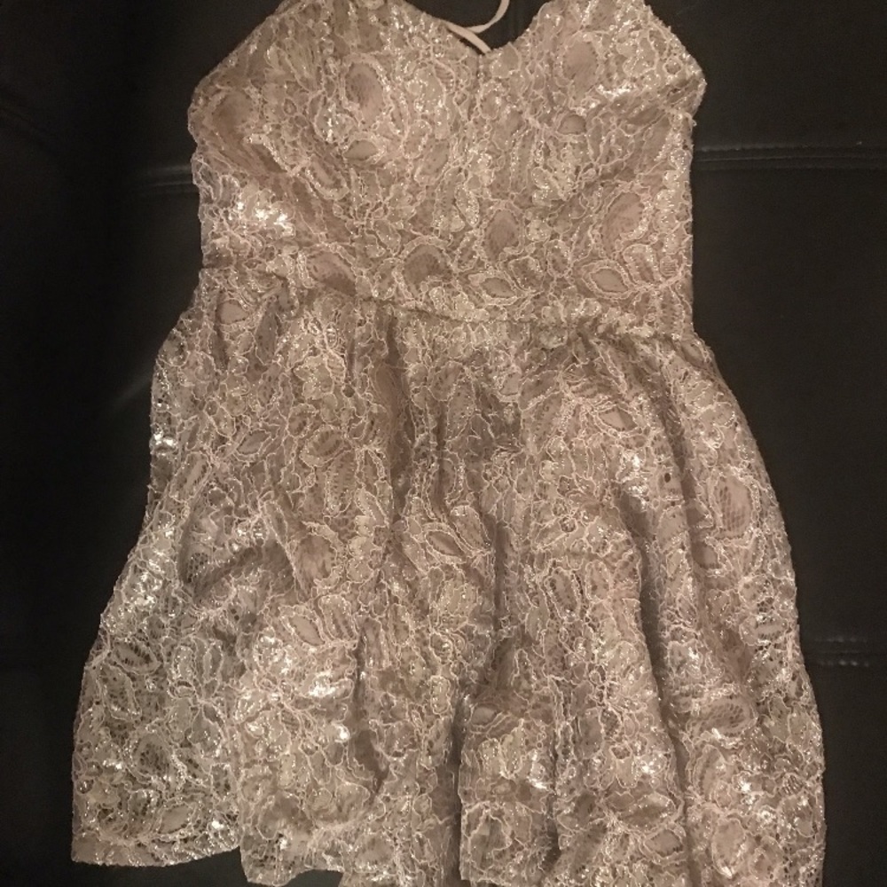 It’s a silver jumpsuit party dress 👗.